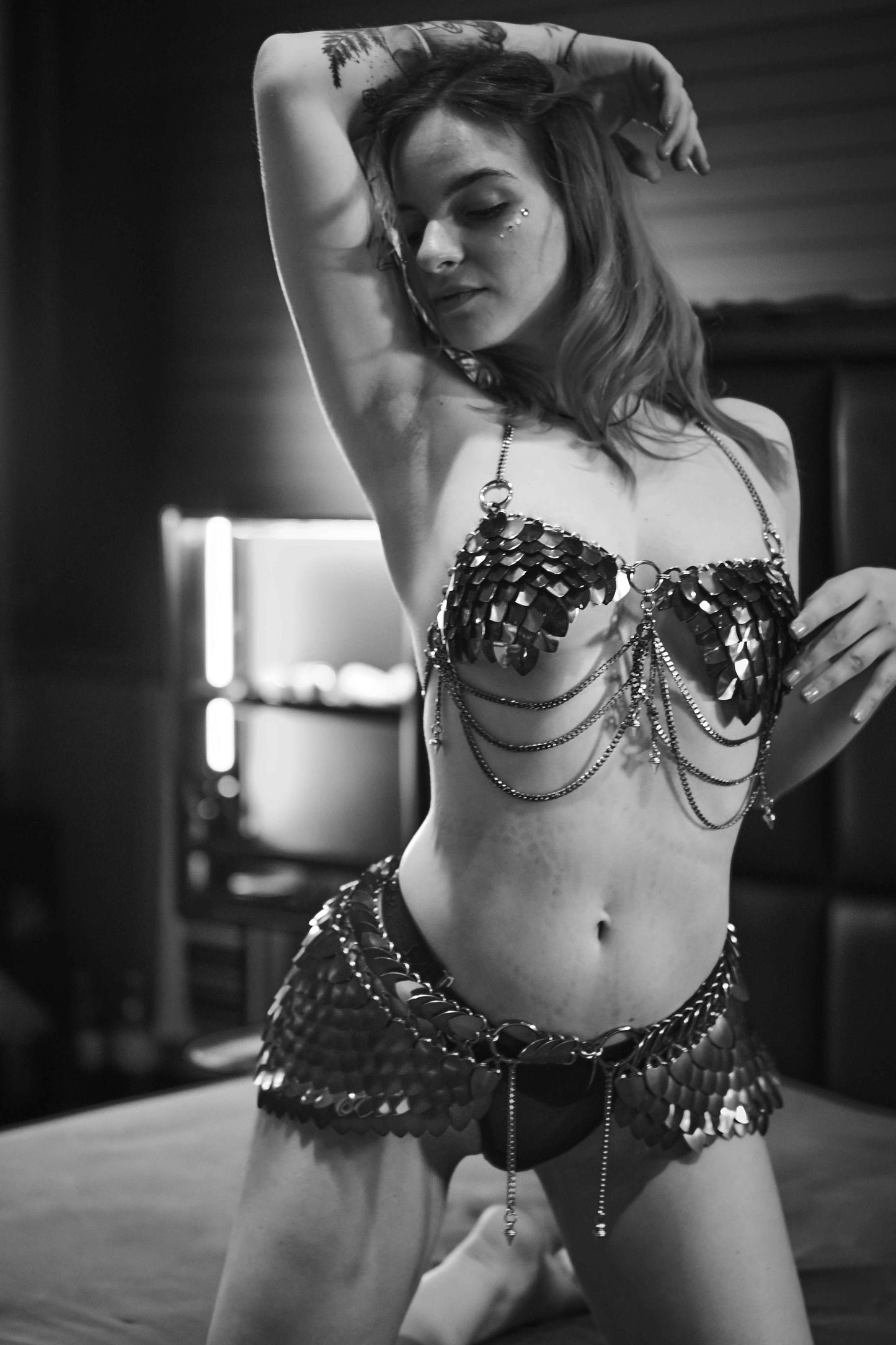 Metal chain bikini in black and silver, stylish and edgy, worn by a confident woman