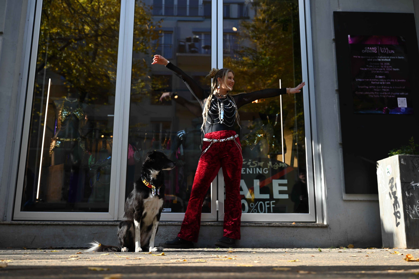 Lisa Majun Store in Berlin Friedrichshain with handcrafted bodychains and clubwear outside with Dog Nala